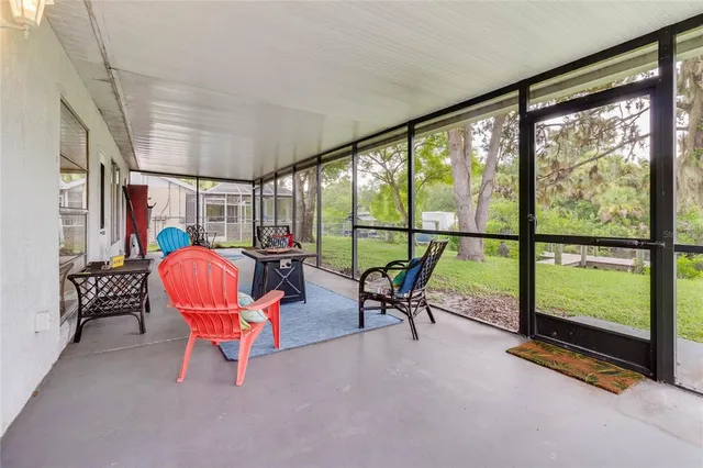 a view of a room with chairs and lounge chairs