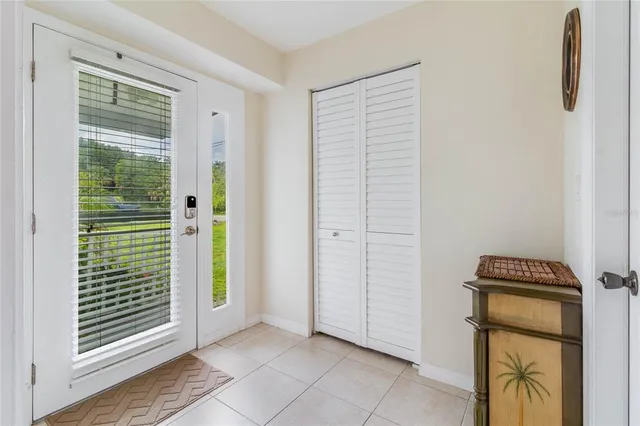 a view of empty room with floor to ceiling window