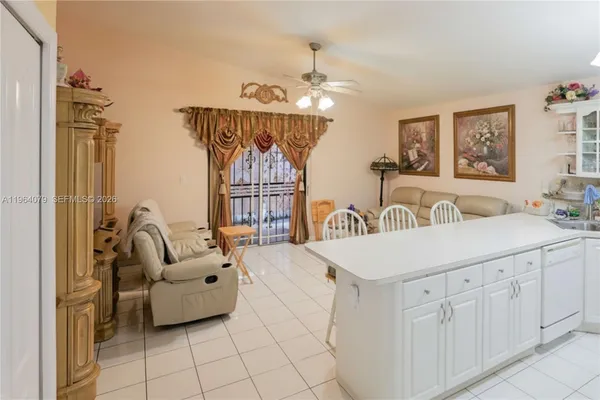 a bedroom with furniture and a chandelier