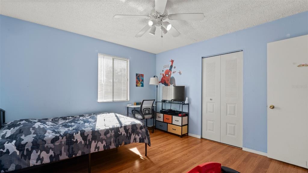 6519 West Newberry Road, Unit 912 Gainesville, FL 32605 - Photo 28 of 47 a bedroom with a bed and a window