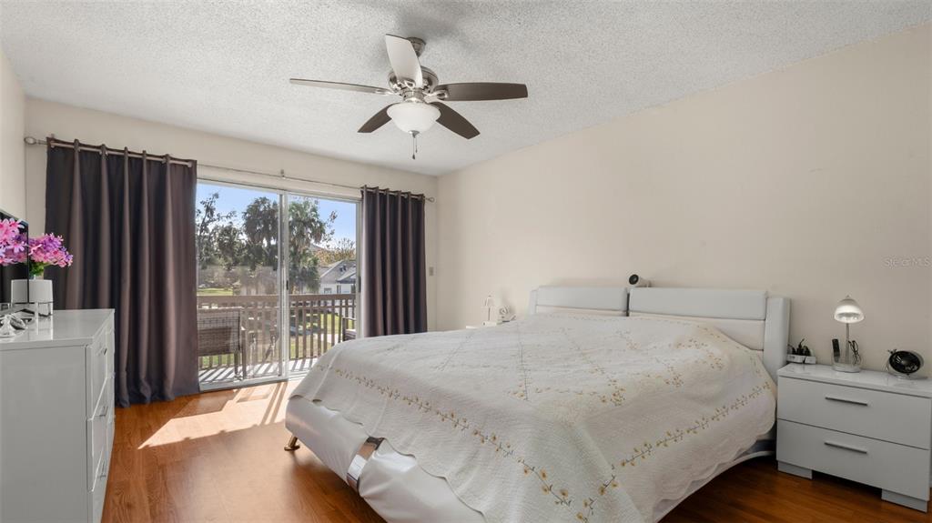 6519 West Newberry Road, Unit 912 Gainesville, FL 32605 - Photo 31 of 47 a bedroom with a large bed and a window