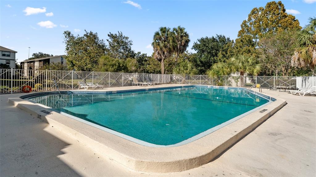 6519 West Newberry Road, Unit 912 Gainesville, FL 32605 - Photo 41 of 47 a view of a pool in a backyard of house