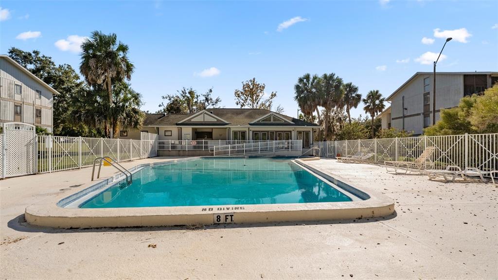 6519 West Newberry Road, Unit 912 Gainesville, FL 32605 - Photo 43 of 47 a view of swimming pool with a yard