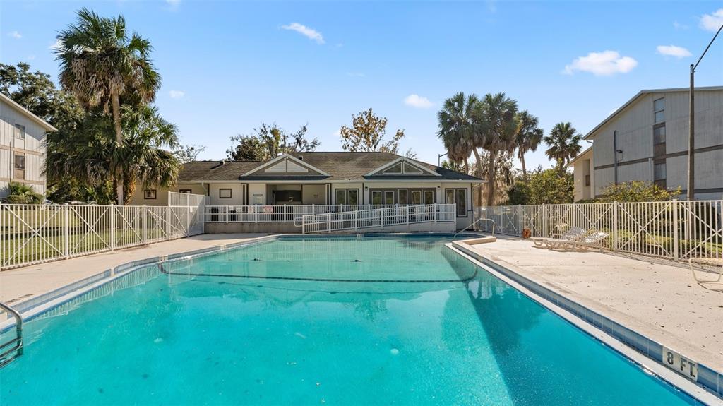 6519 West Newberry Road, Unit 912 Gainesville, FL 32605 - Photo 45 of 47 a view of house with a swimming pool