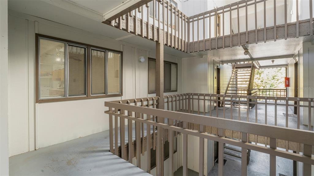 6519 West Newberry Road, Unit 912 Gainesville, FL 32605 - Photo 5 of 47 a view of staircase with large window