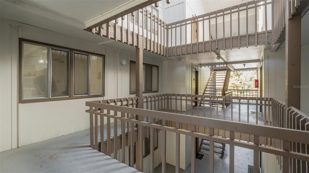 6519 West Newberry Road, Unit 912 Gainesville, FL 32605 - Photo 6 of 47 a view of staircase with large window