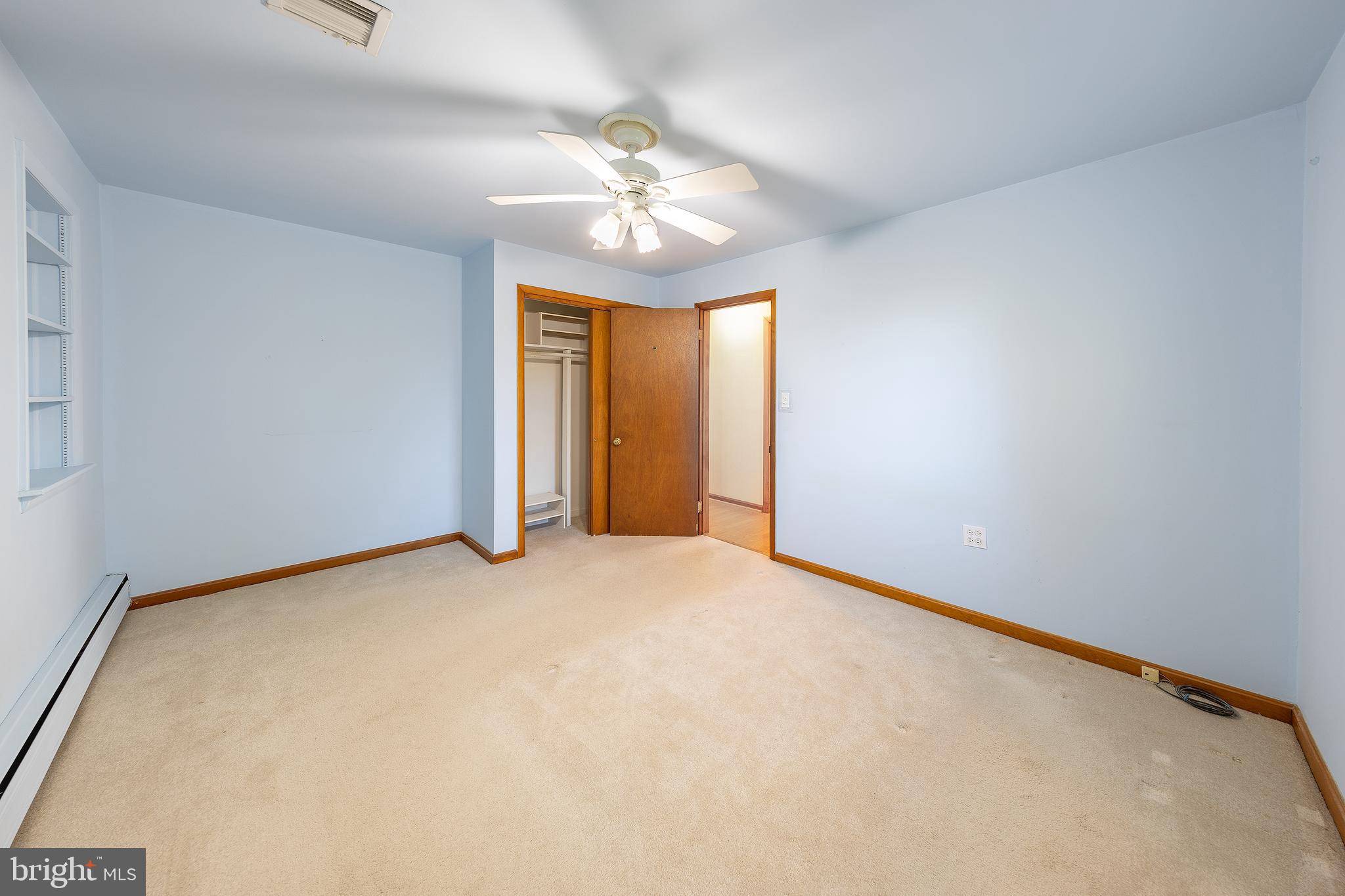 23045 Watson Road Leesburg, VA 20175 - Photo 18 of 69 an empty room with windows and chandelier fan