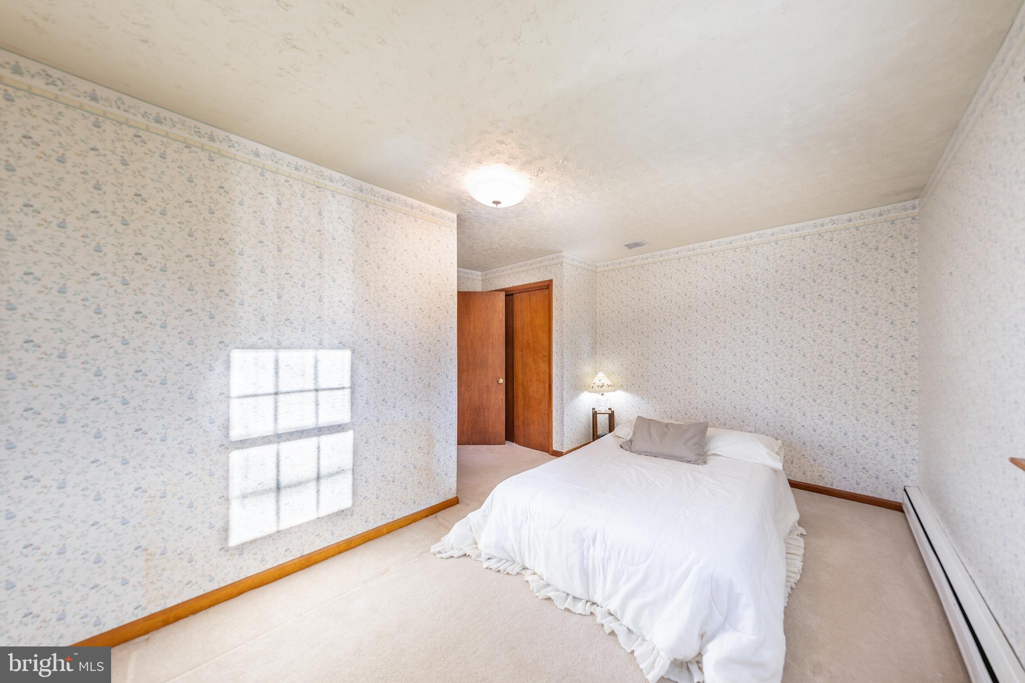 23045 Watson Road Leesburg, VA 20175 - Photo 20 of 69 a bedroom with a bed and a window