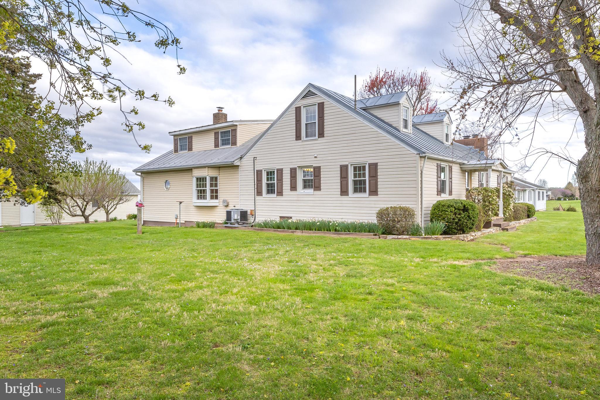 23045 Watson Road Leesburg, VA 20175 - Photo 2 of 69 a front view of house with yard and green space