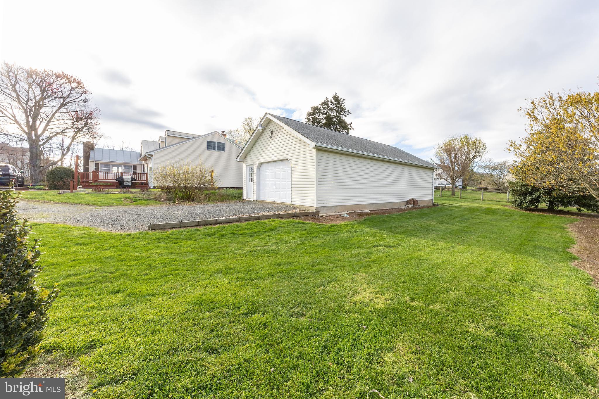 23045 Watson Road Leesburg, VA 20175 - Photo 44 of 69 a big house with a big yard and large trees
