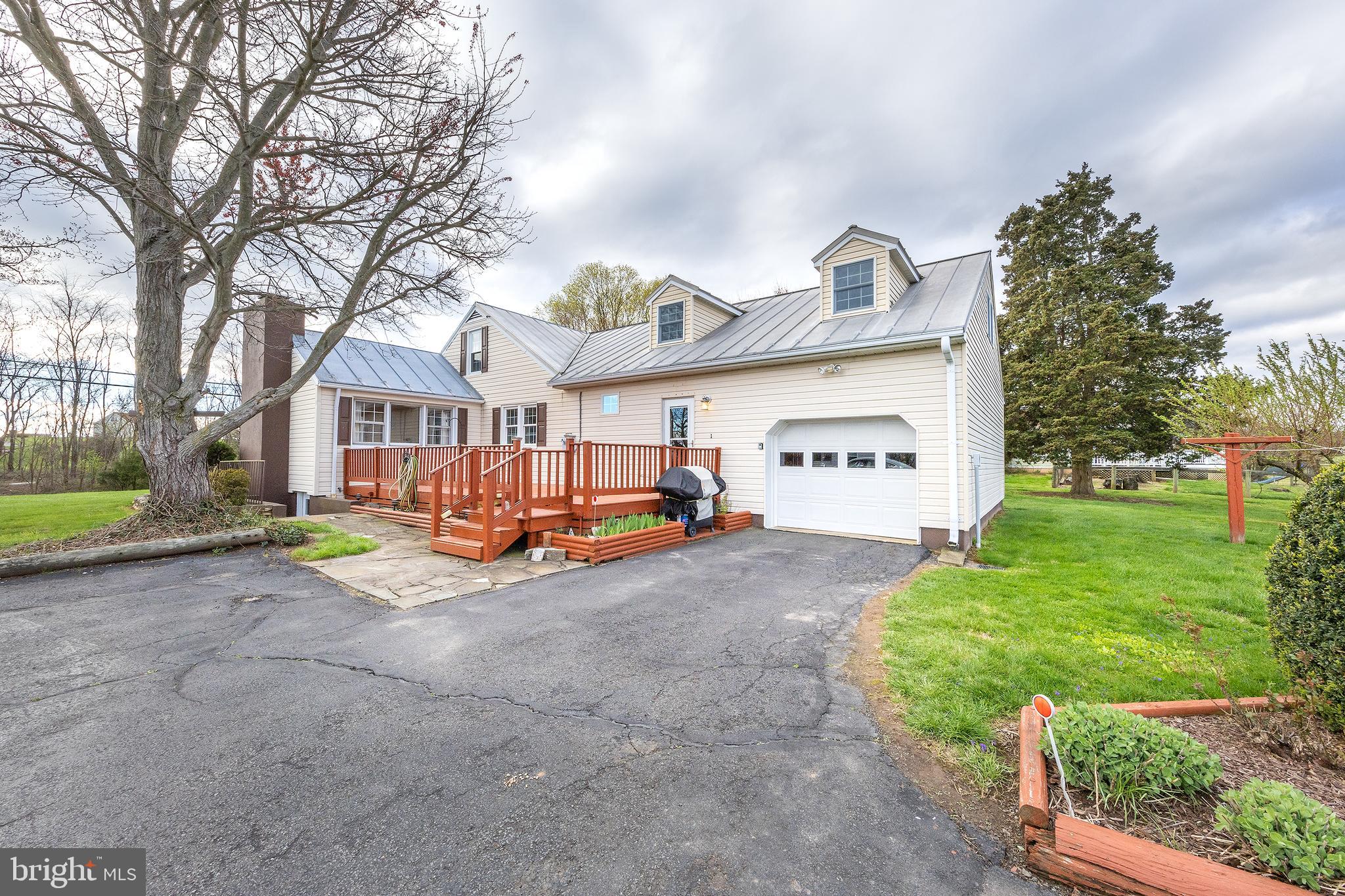 23045 Watson Road Leesburg, VA 20175 - Photo 5 of 69 a view of a house with a yard and pathway