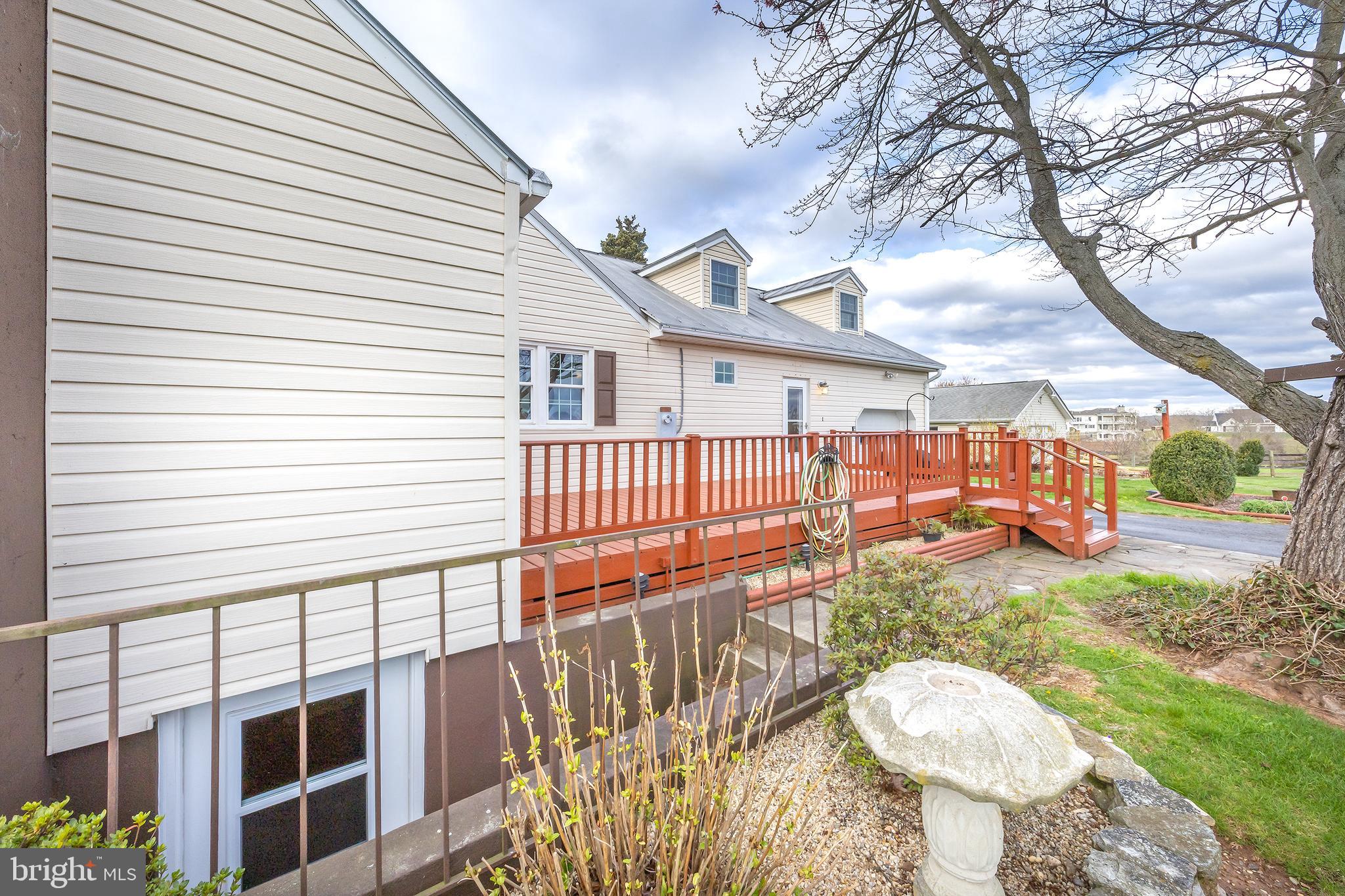 23045 Watson Road Leesburg, VA 20175 - Photo 7 of 69 a balcony with table and chairs and wooden fence