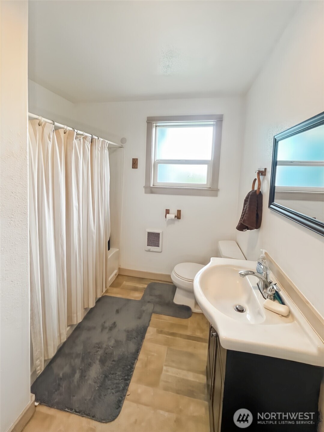 19 Fairley Street Raymond, WA 98577 - Photo 11 of 17 a bathroom with a sink and a mirror