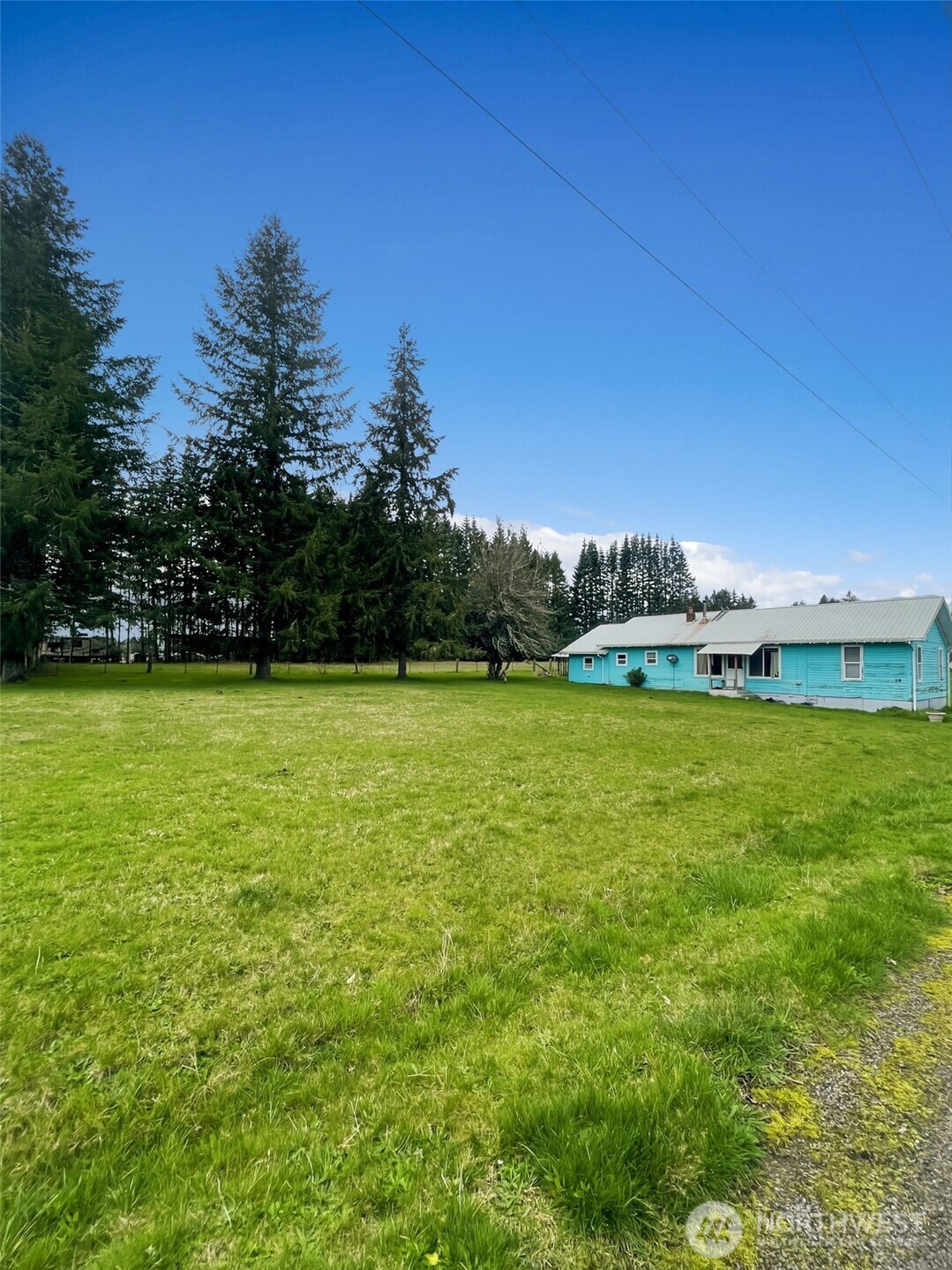 19 Fairley Street Raymond, WA 98577 - Photo 2 of 17 a view of a green field with clear sky