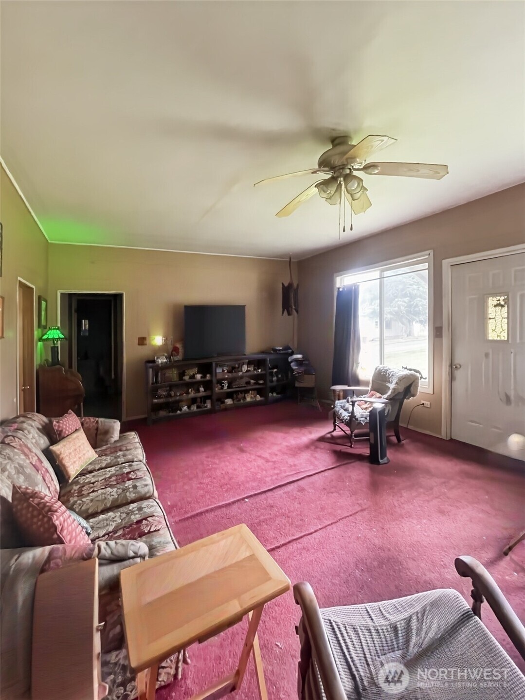 19 Fairley Street Raymond, WA 98577 - Photo 6 of 17 a living room with furniture and a flat screen tv