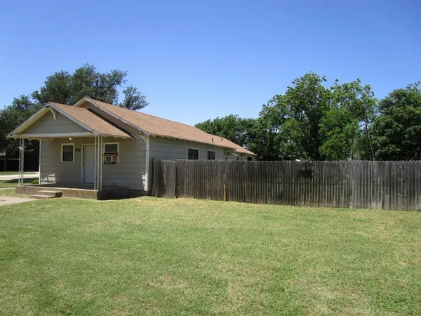 a backyard of a house with lots of green space