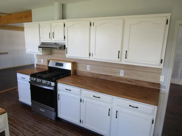a utility room with cabinets washer and dryer