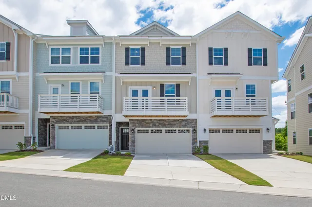 a front view of building with yard