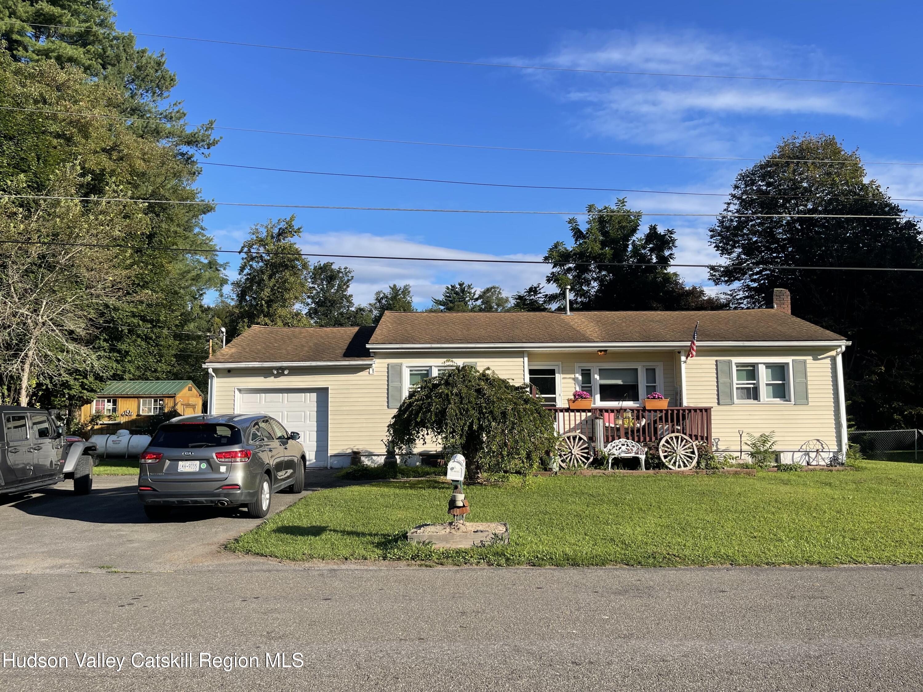 10 Johns Road Kerhonkson, NY 12446 - Photo 1 of 30 a front view of a house with a garden and yard