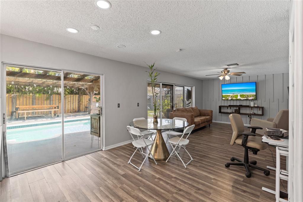 520 Sumter Avenue Davie, FL 33325 - Photo 11 of 44 a workspace with furniture hardwood and a window