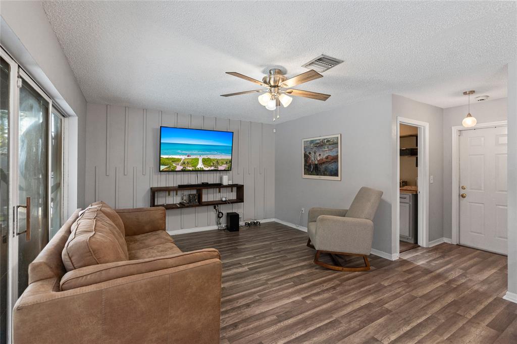 520 Sumter Avenue Davie, FL 33325 - Photo 13 of 44 a living room with furniture and a flat screen tv