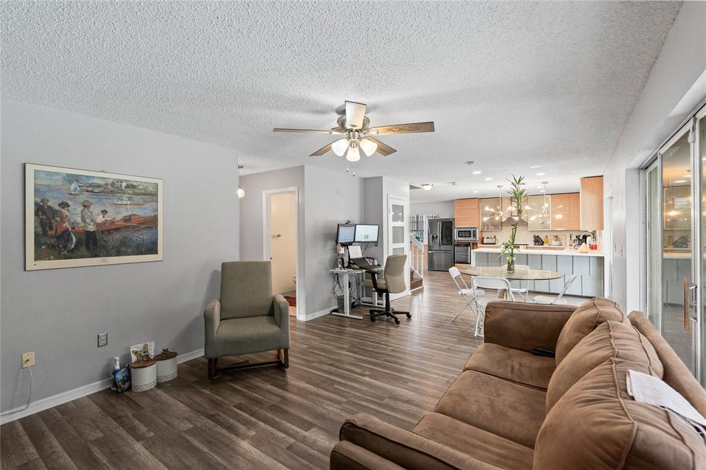520 Sumter Avenue Davie, FL 33325 - Photo 16 of 44 a living room with furniture and view of kitchen