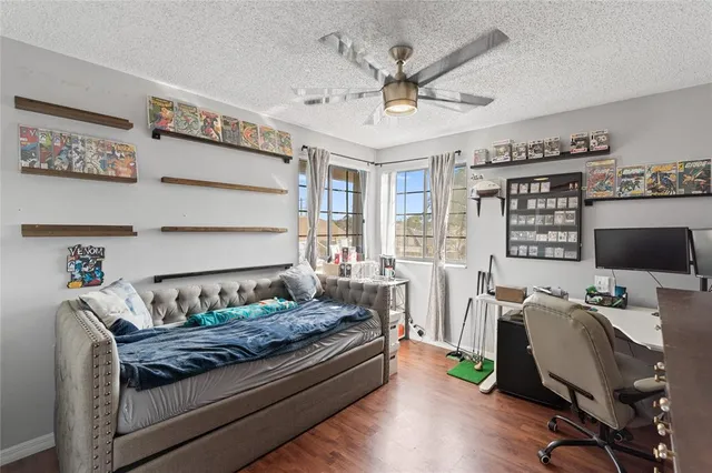 a bedroom with furniture and a window