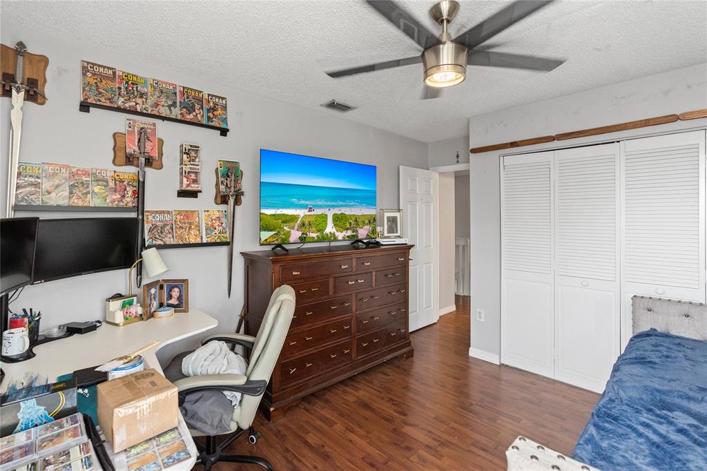 520 Sumter Avenue Davie, FL 33325 - Photo 18 of 44 a workspace with furniture and wooden floor