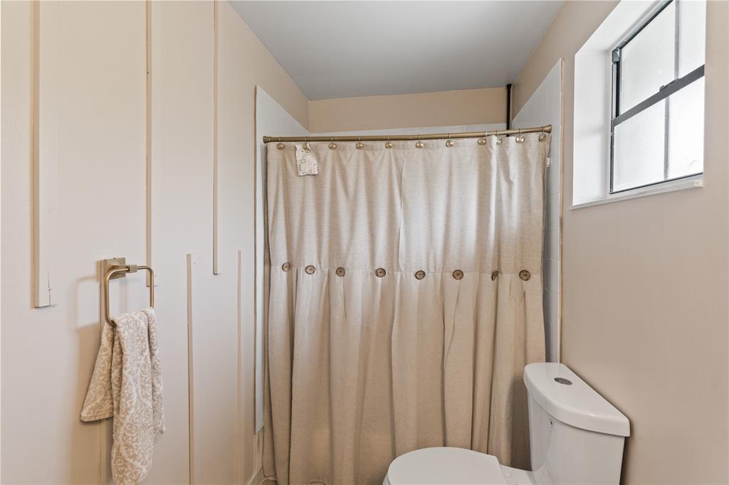 520 Sumter Avenue Davie, FL 33325 - Photo 20 of 44 a bathroom with a shower curtain