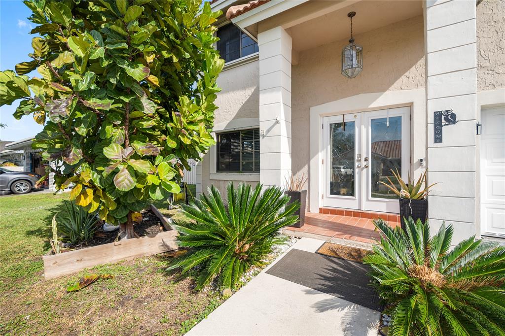 520 Sumter Avenue Davie, FL 33325 - Photo 2 of 44 a front view of a house with a yard