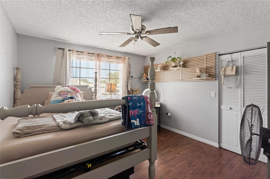 520 Sumter Avenue Davie, FL 33325 - Photo 31 of 44 a bedroom with a bed and wooden floor