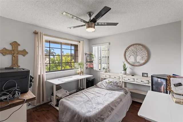 a living room with furniture a large window and a clock