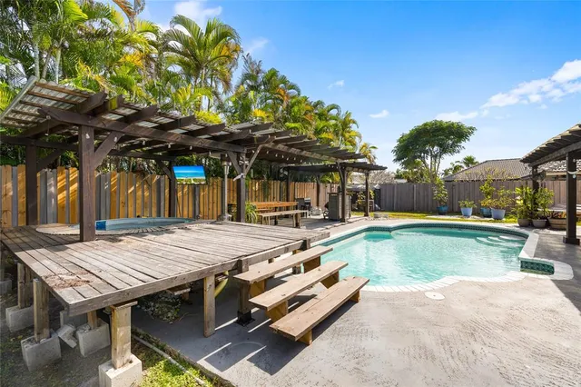 a view of a swimming pool with a patio