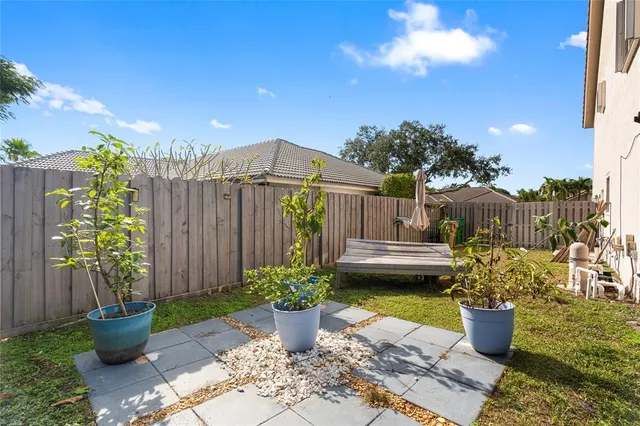 a view of swimming pool with a outdoor seating