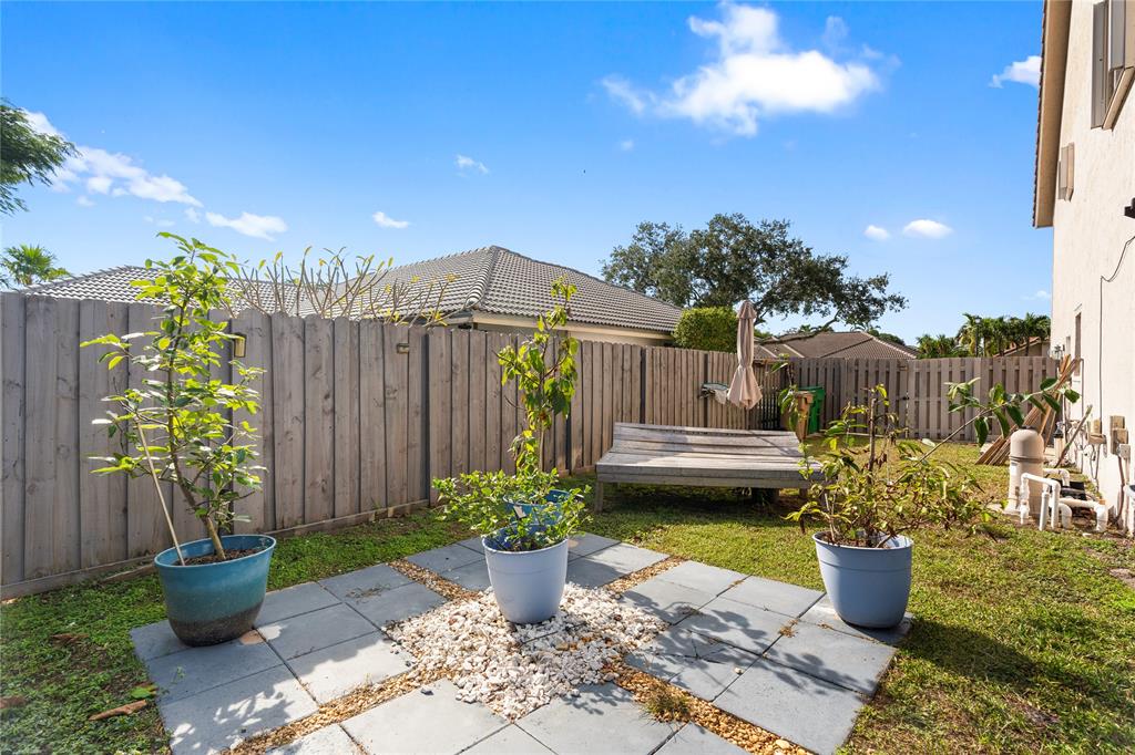 520 Sumter Avenue Davie, FL 33325 - Photo 41 of 44 a view of a balcony with potted plants