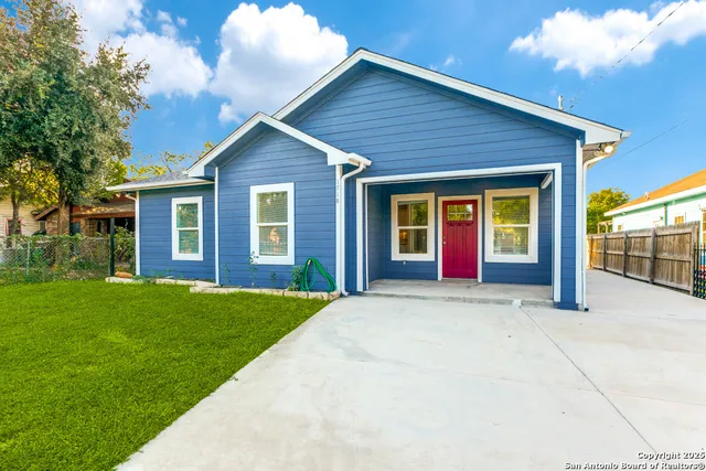 a front view of a house with yard