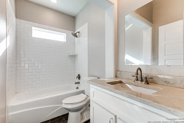 a bathroom with a sink a toilet and a bathtub