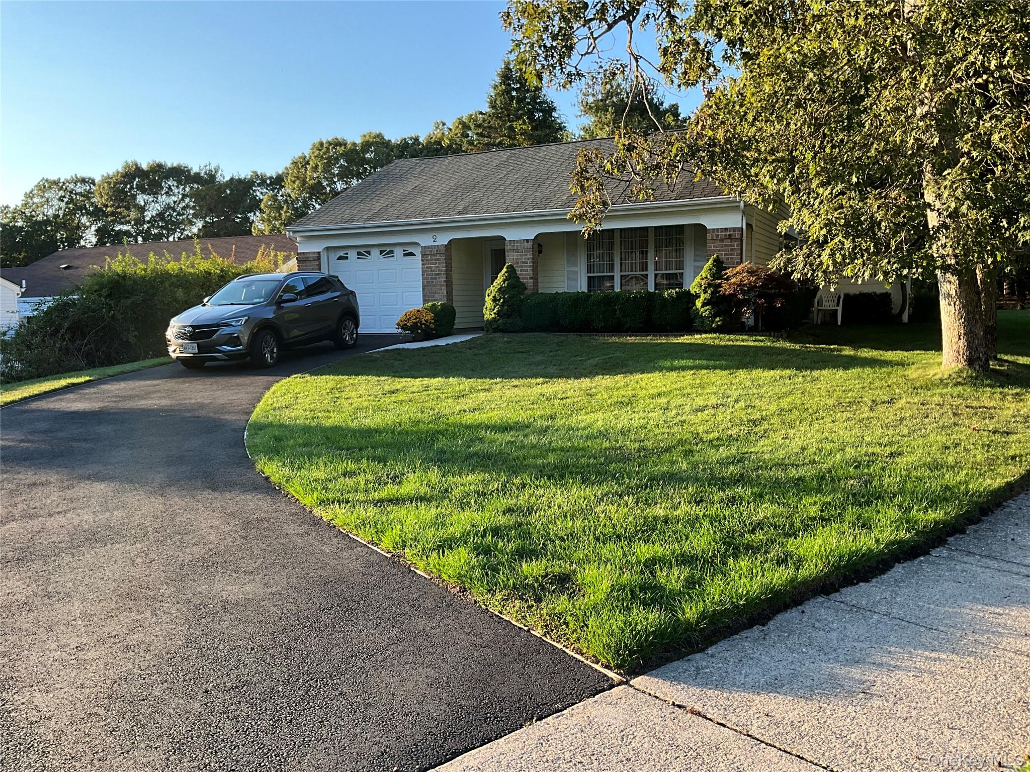 2 Kingston Drive Ridge, NY 11961 - Photo 1 of 1 a front view of a house with garden