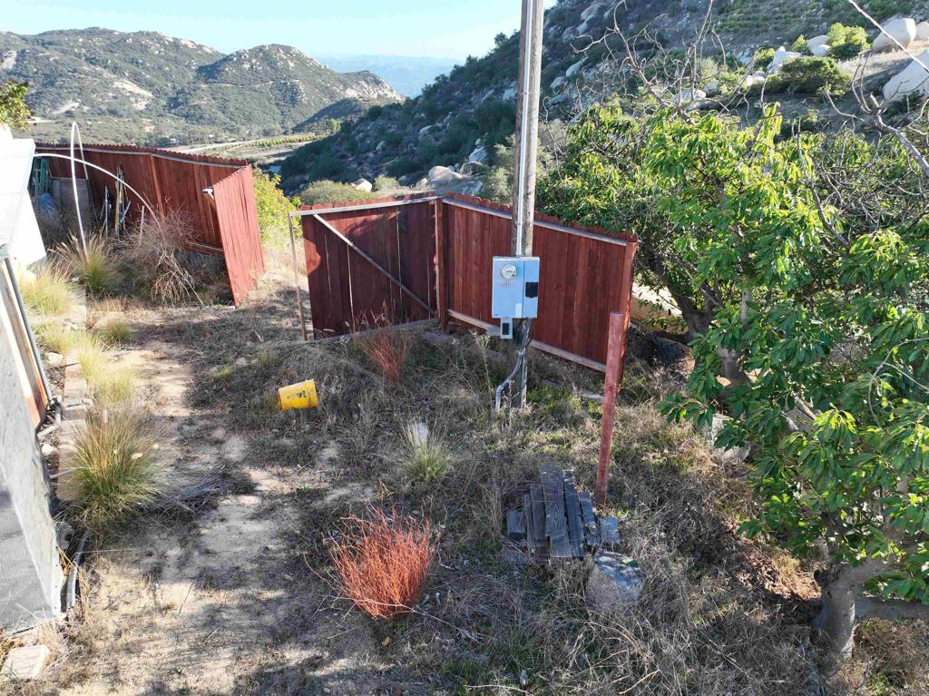 Rainbow Peaks Trail Fallbrook, CA 92028 - Photo 9 of 48 a backyard of a house with table and chairs