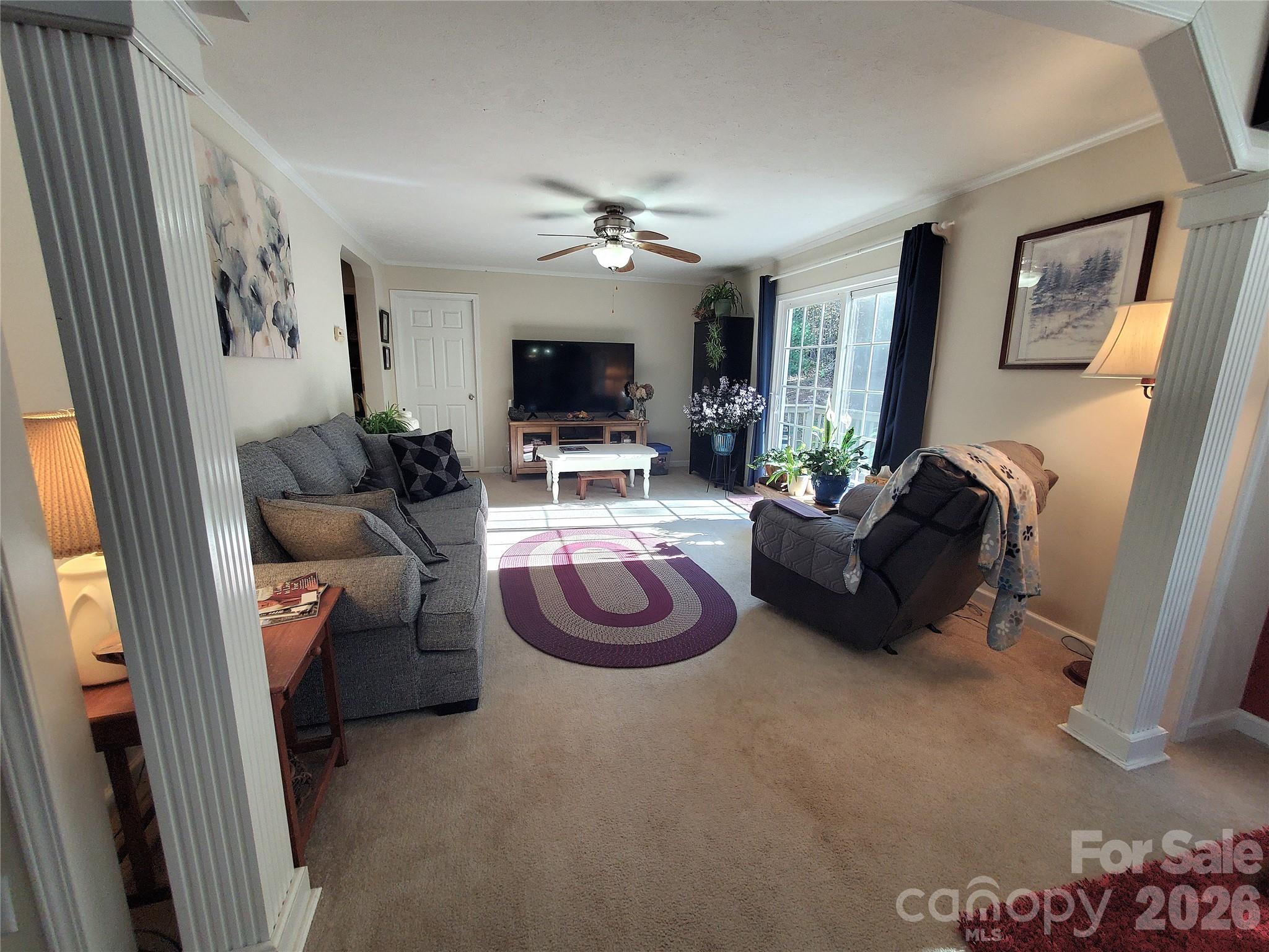 457 Dale Road Spruce Pine, NC 28777 - Photo 13 of 36 a living room with furniture and a flat screen tv
