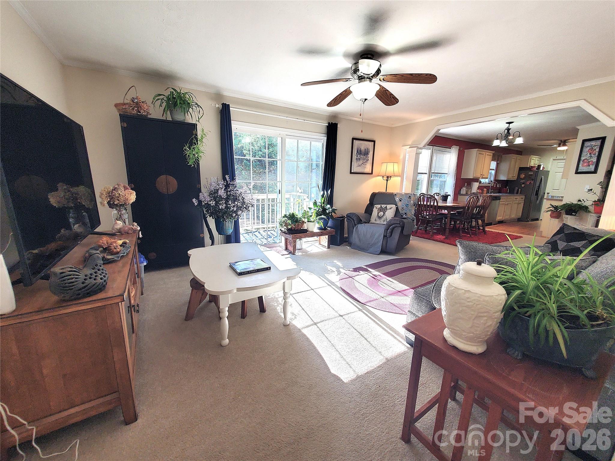 457 Dale Road Spruce Pine, NC 28777 - Photo 14 of 36 a living room with furniture and a flat screen tv