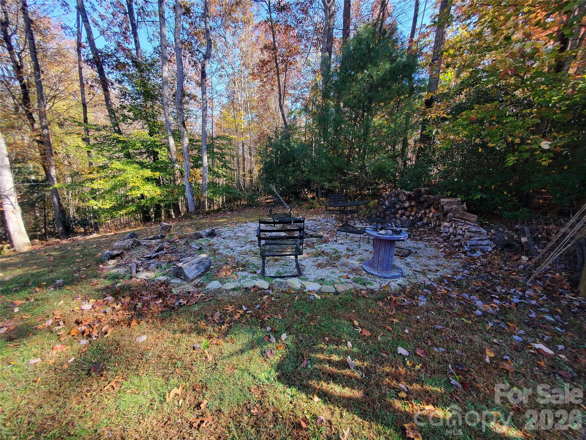 457 Dale Road Spruce Pine, NC 28777 - Photo 30 of 36 a backyard of a house with table and chairs