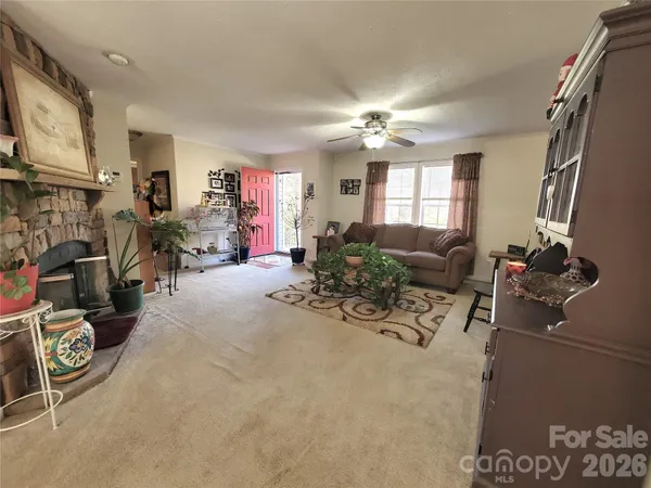 a view of a livingroom with furniture and a flat screen tv