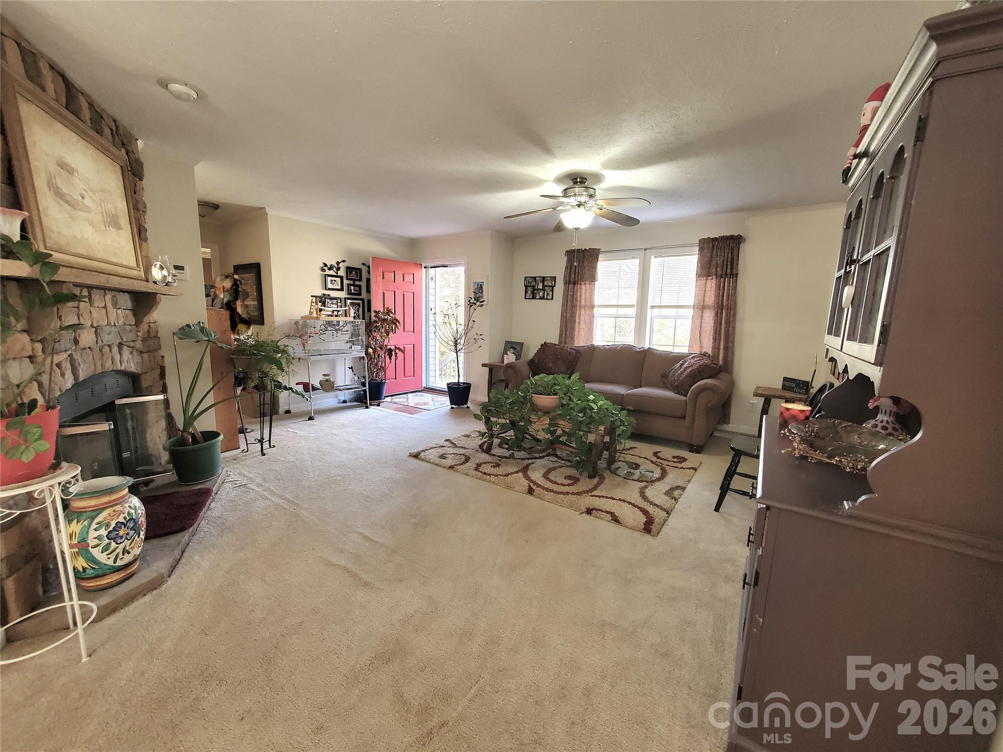 457 Dale Road Spruce Pine, NC 28777 - Photo 9 of 36 a view of a livingroom with furniture and a flat screen tv