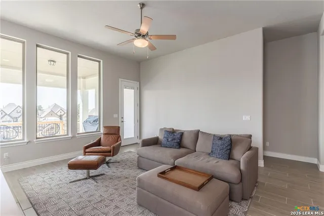 a living room with furniture and a large window