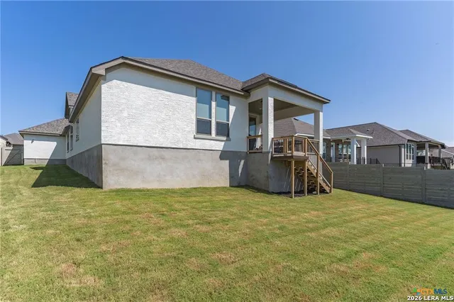 a view of front of house with a yard