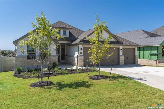 a house that has a big yard and plants