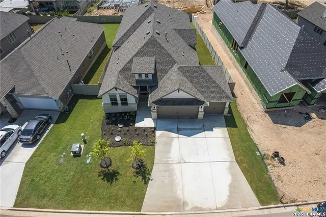 an aerial view of a house with swimming pool