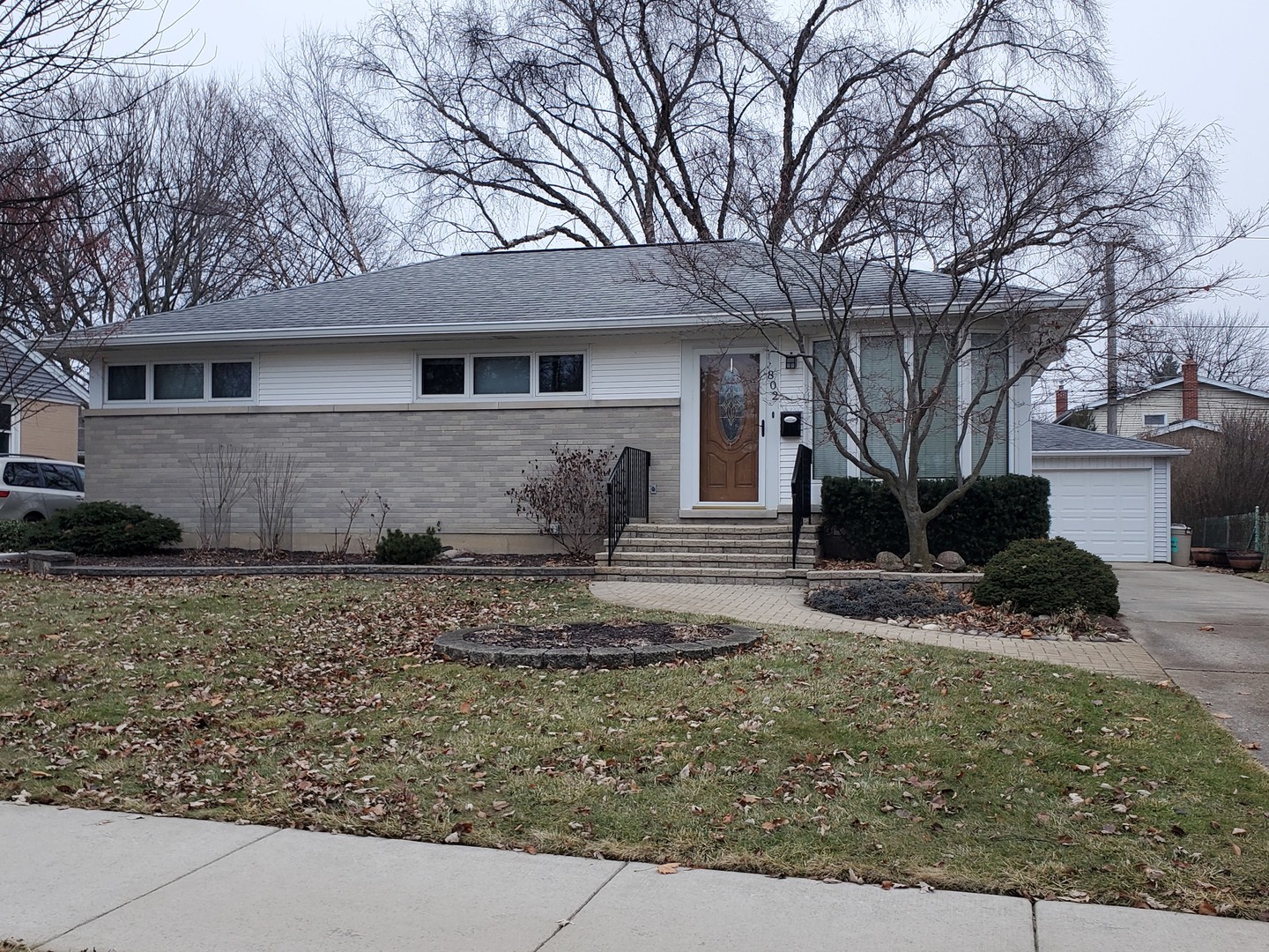 802 West Busse Avenue Mount Prospect, IL 60056 - Photo 1 of 9 a front view of a house with a yard