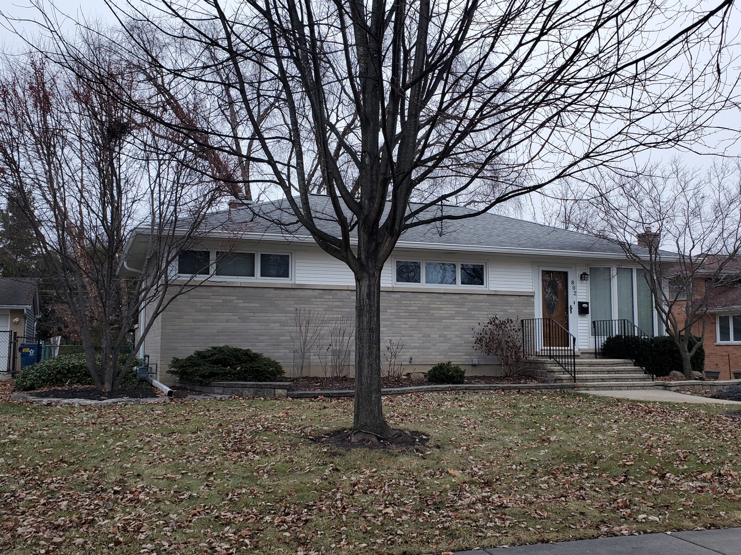 802 West Busse Avenue Mount Prospect, IL 60056 - Photo 3 of 9 a front view of a house with garden